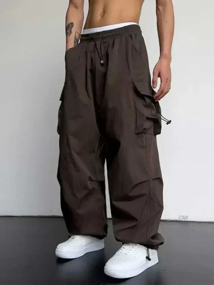 Comfortable men's utility cargo pants in brown, ideal for durable casual wear & outdoor adventures.