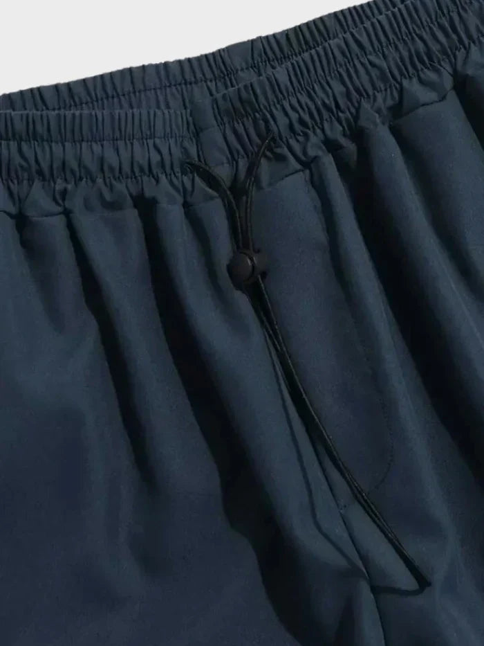 Black men's cargo pants, a stylish & comfortable choice for casual wear and urban outdoor utility.