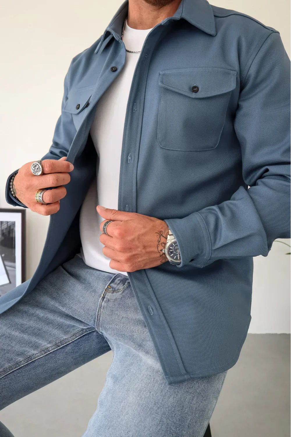 Stylish men's layering piece: casual overshirt. This button-up long-sleeve top is great for everyday menswear.