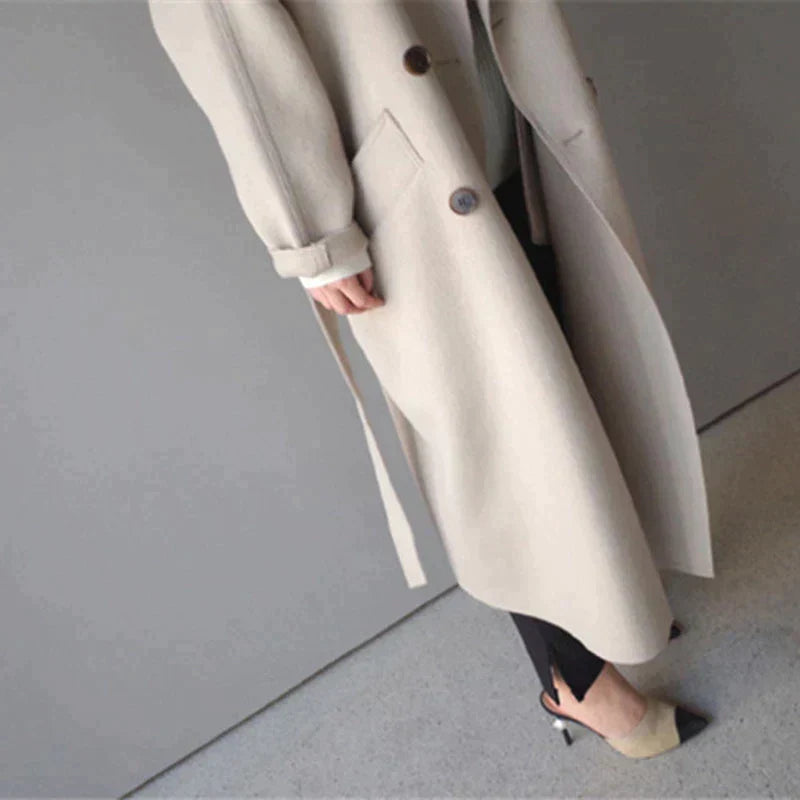 Long women's warm coat for winter, featuring an elegant design perfect for ladies' outerwear.