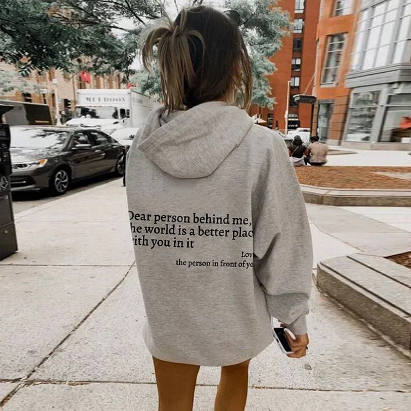 Uplifting women's hooded sweatshirt, "Spread Positivity & Comfort" design. Perfect everyday casual style.