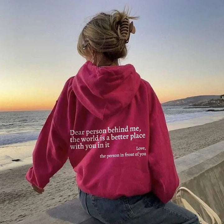 Cozy women's hooded sweatshirt, Aurora style, featuring a positive message for comfort & everyday wear.
