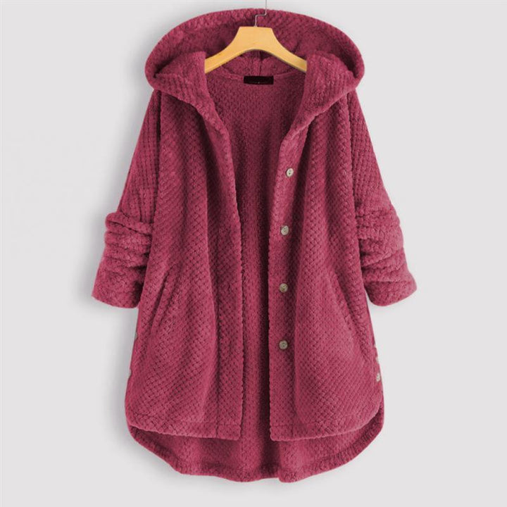 FleeceLux women's hooded fleece jacket, reversible design, offering both contemporary style and warmth.