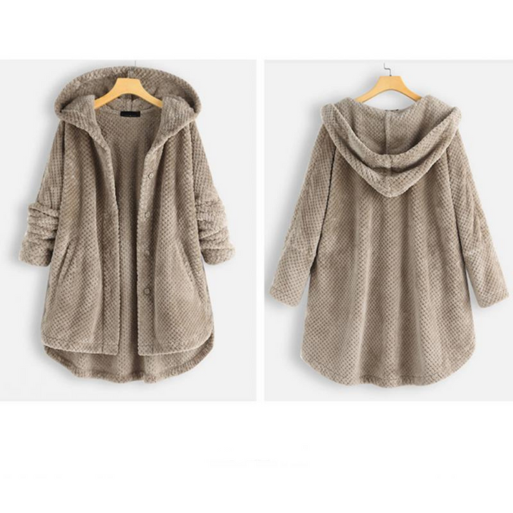 Fashionable women's hooded jacket, FleeceLux, combines cozy comfort with functional stylish appeal.