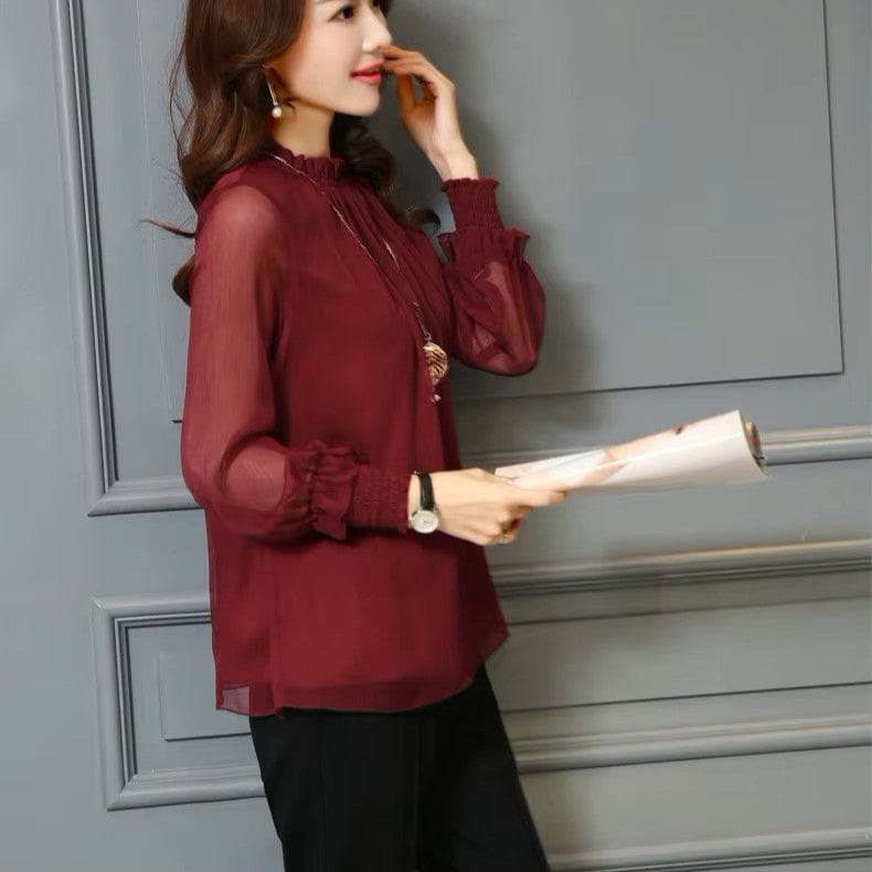 Stylish women's blouse with statement sheer puff sleeves & subtle ruffles, a feminine top for any occasion.