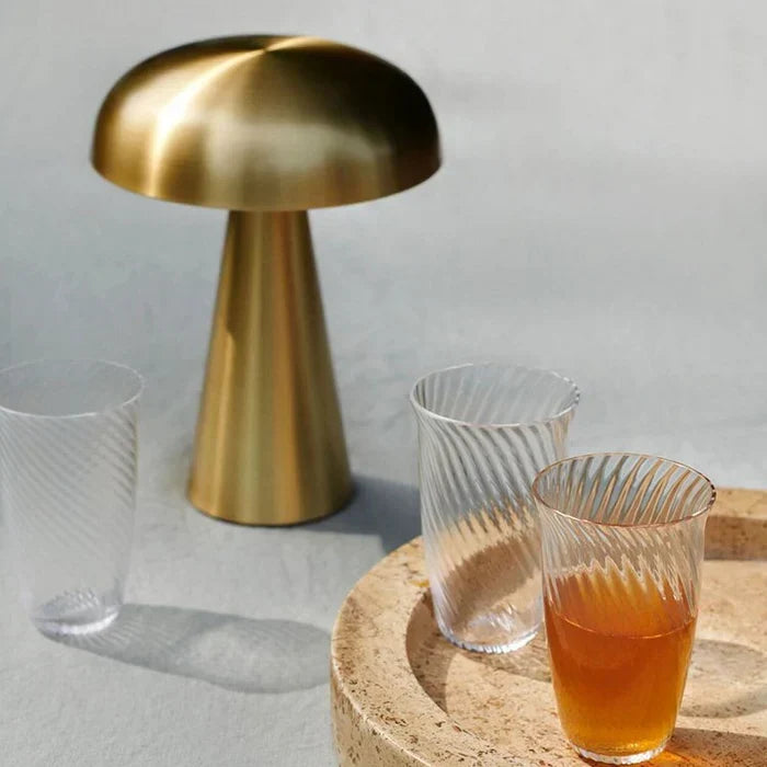 Rechargeable wireless LED table lamp, modern design for portable ambient light, great as a night light.