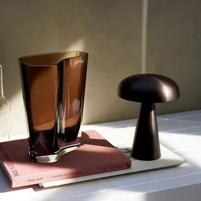 Sleek wireless LED portable lamp, rechargeable table light for modern ambient decor & home lighting.