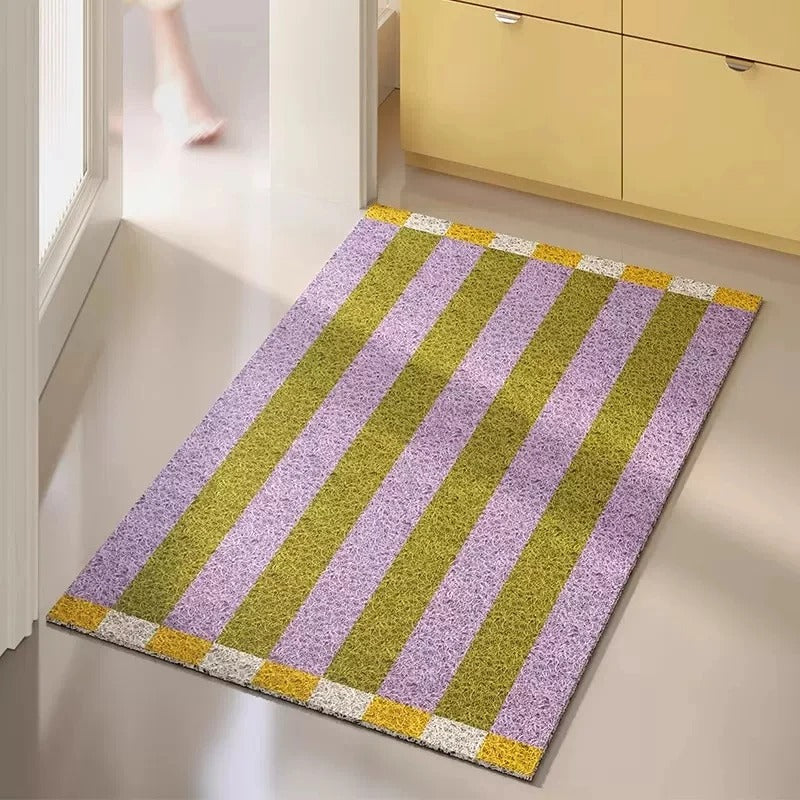 Welcoming striped PVC doormat. Durable and anti-slip for indoor & outdoor entryways. A functional home decor accent.