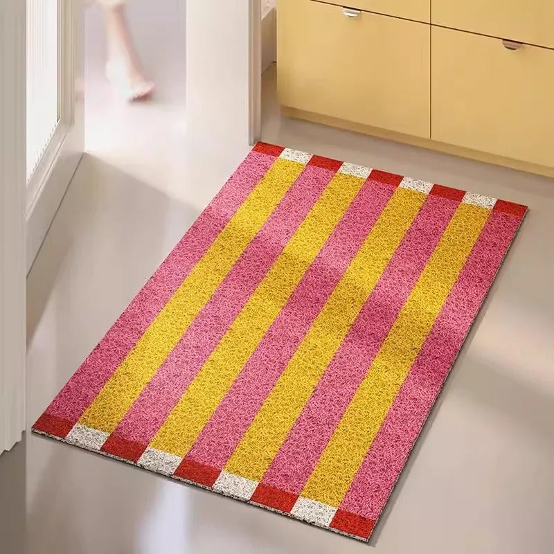Easy-clean striped entryway mat. Durable PVC construction, anti-slip design for outdoor and indoor use.