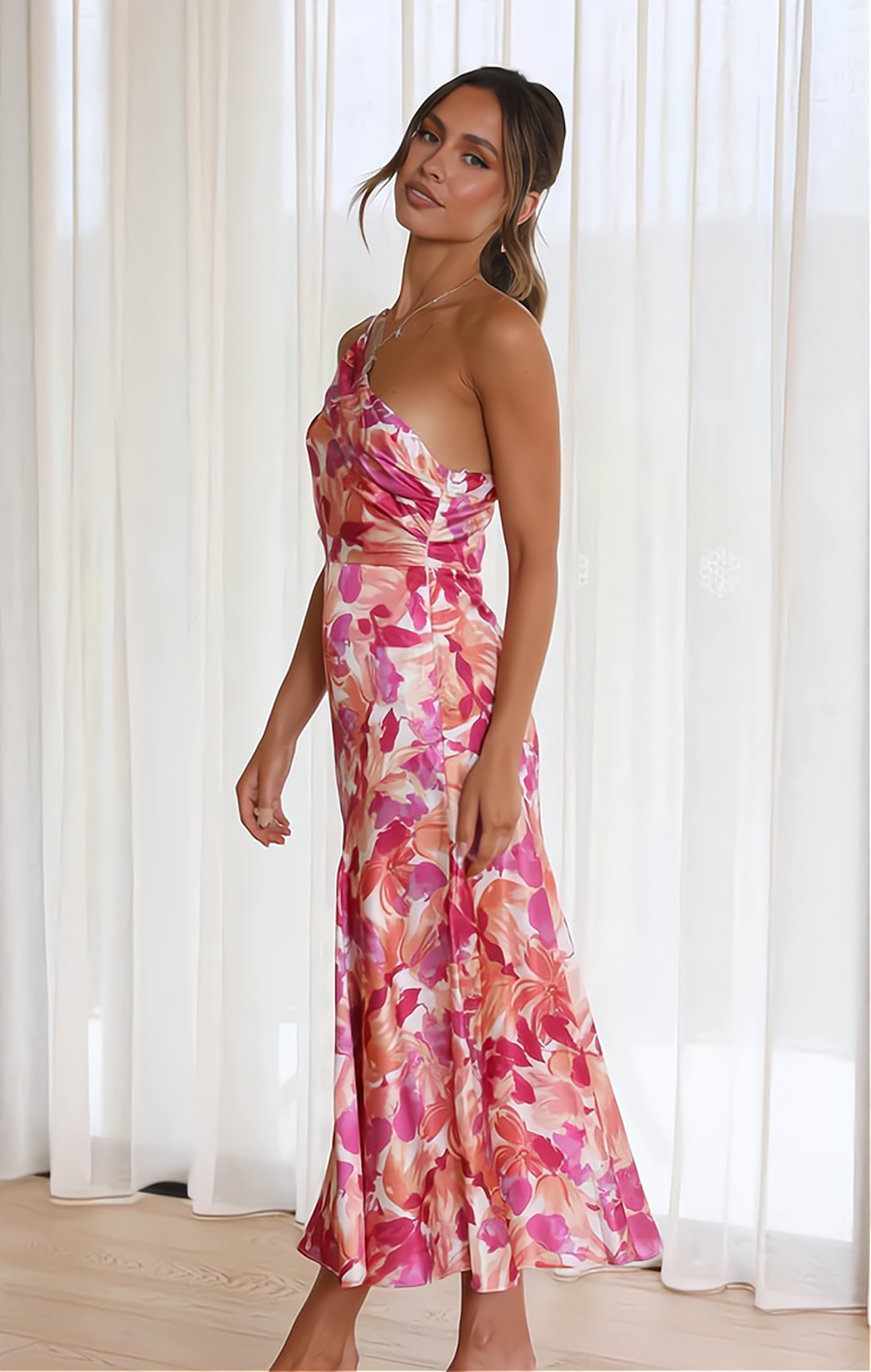 Elegant women's floral off-shoulder casual dress, featuring delicate spaghetti straps, ideal for warm summer days.