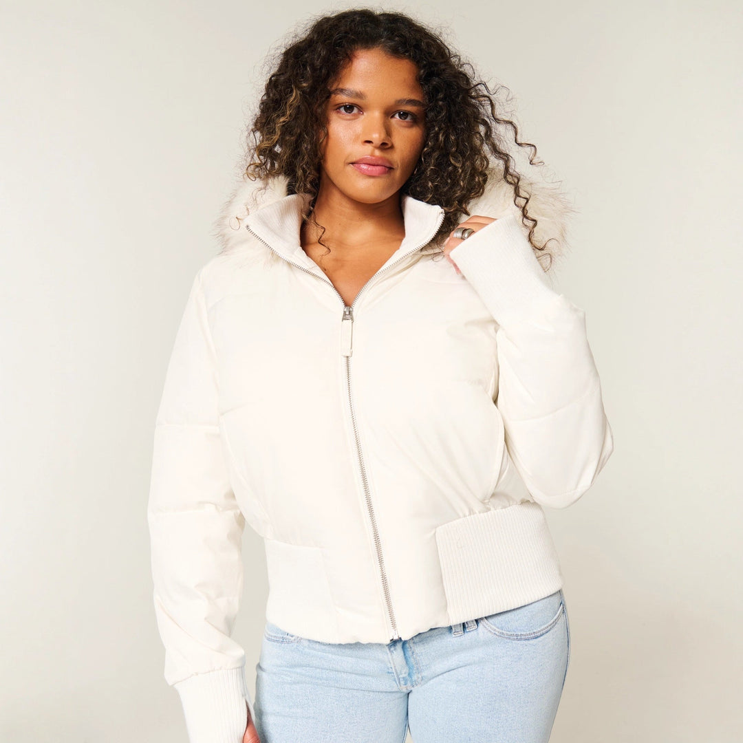 Cozy pink quilted jacket for women, featuring a trendy cropped silhouette and detachable hood.