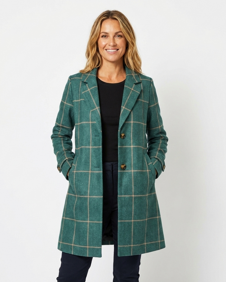 Stylish women's long checkered trench coat with a classic lapel, perfect outerwear for fall and winter fashion.