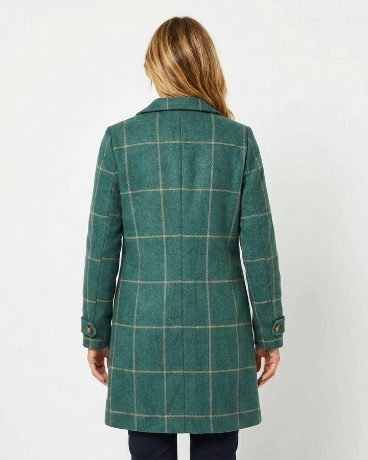 Elegant long checkered trench coat for women, featuring a sharp lapel. A versatile and fashionable outerwear piece.
