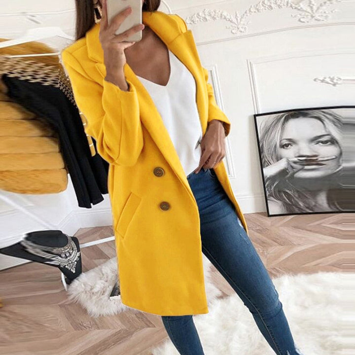 Stylish women's Mila coat in classic black, featuring a turn-down collar and button-up front.