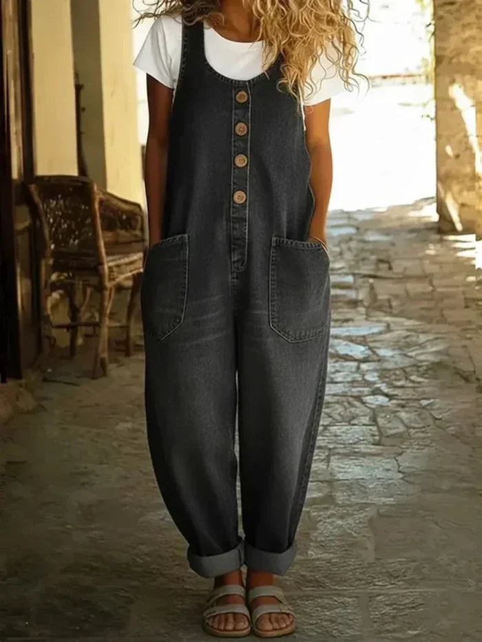 Fashionable women's wide leg button-front overalls. Features a relaxed silhouette and convenient patch pockets.