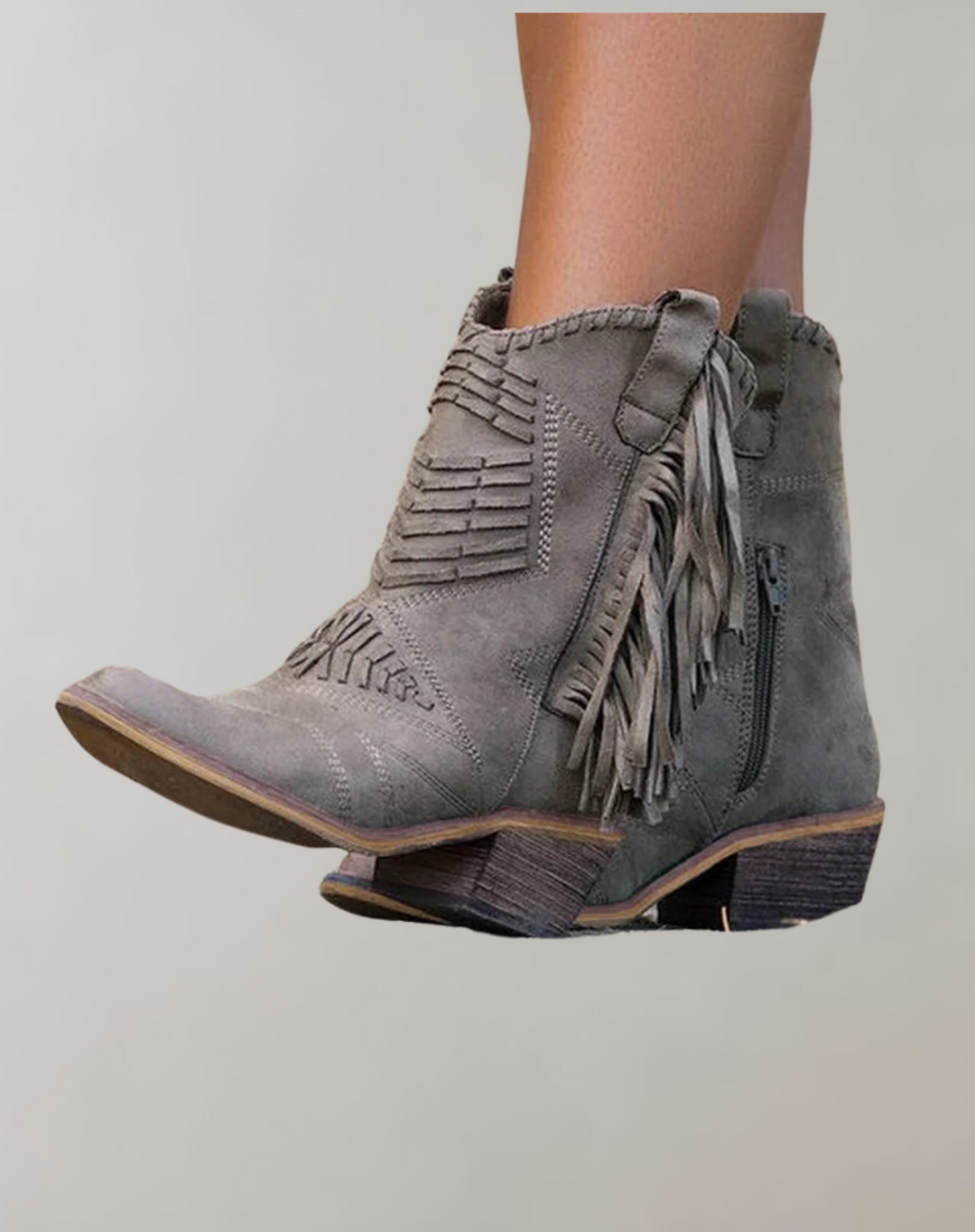 Stylish women's tasseled ankle boots in black, perfect for fall and winter fashion. Chic and comfortable everyday footwear.