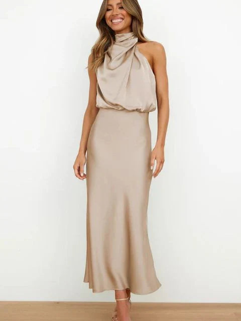 Elegant Sleeveless High Neck Satin Gown. Perfect flowy evening dress for summer parties & formal occasions.