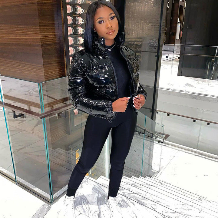 Stylish women's puffer bomber jacket. Cozy winter outerwear, perfect for cold.