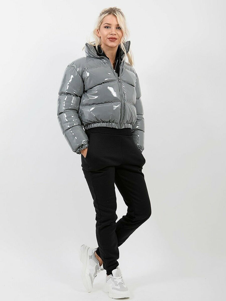 Pink women's fashion puffer bomber jacket. Stylish winter coat for women.