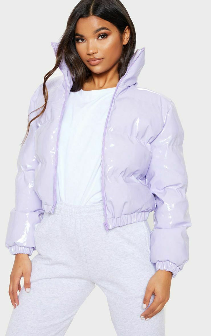 Colorful women's puffer bomber jacket. Trendy winter fashion coat, warm.