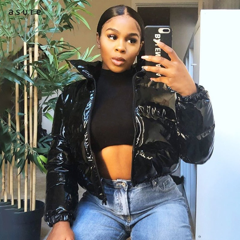 Durable women's puffer bomber jacket. Warm winter outerwear, trendy fashion.