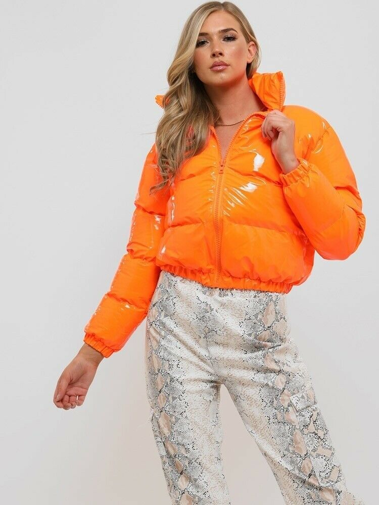 Green women's puffer bomber jacket. Warm and trendy winter fashion outerwear.