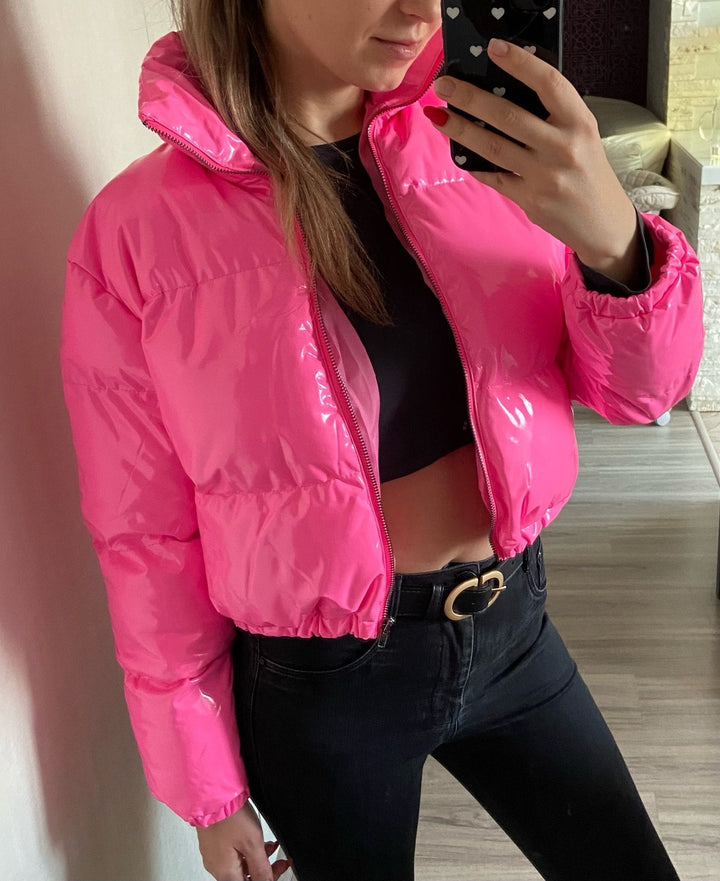 Blue women's stylish puffer bomber jacket. Trendy winter coat for fashion.