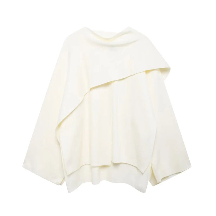 Comfortable & stylish asymmetrical winter poncho for women, perfect for a cozy fall layered look.