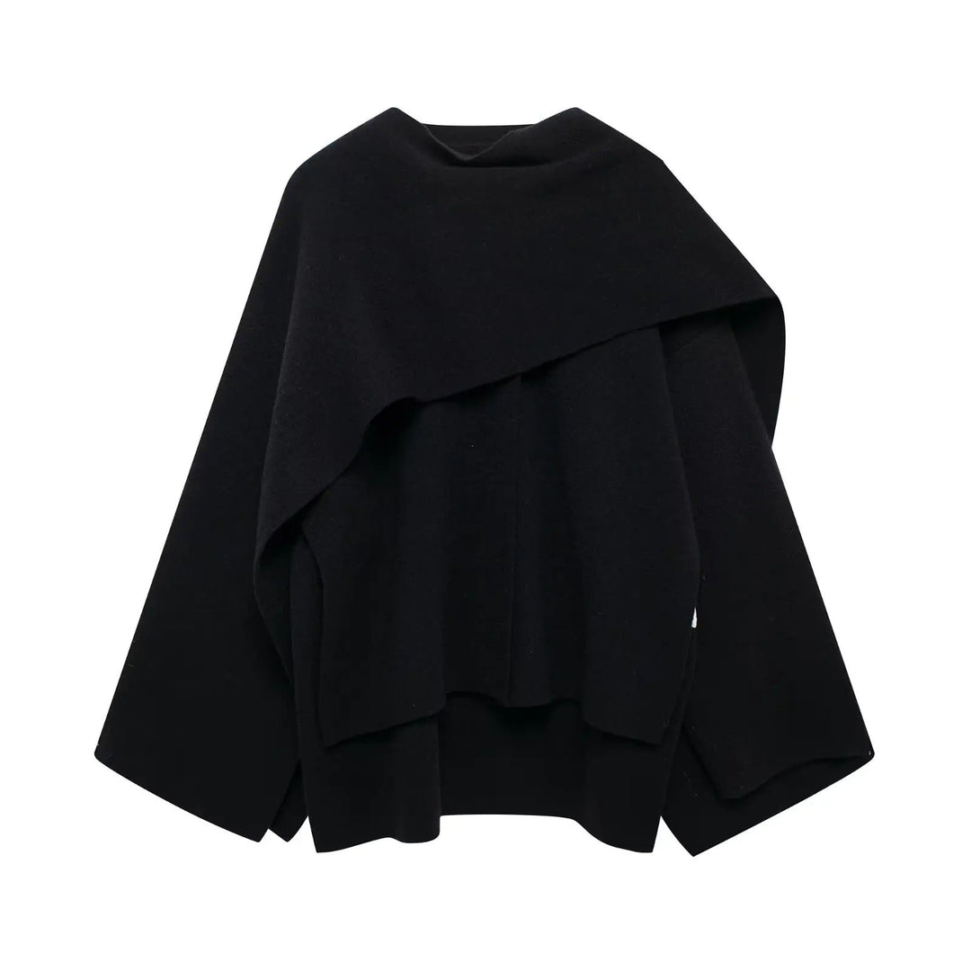 Women's stylish asymmetrical winter poncho in dark blue, oversized and cozy outerwear.