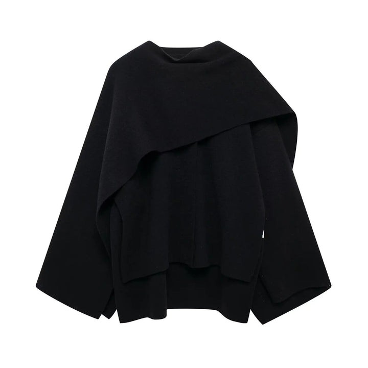 Women's stylish asymmetrical winter poncho in dark blue, oversized and cozy outerwear.