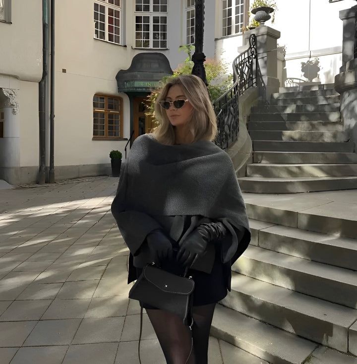 Cozy grey asymmetrical winter poncho, comfortable & fashionable women's apparel for fall.