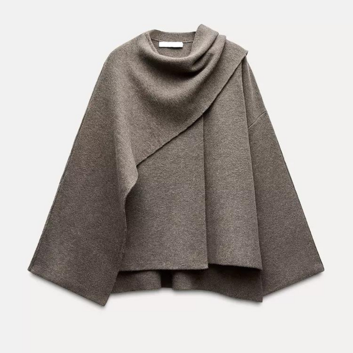 Unique asymmetrical women's winter poncho, stylish outerwear for a distinctive layered look.