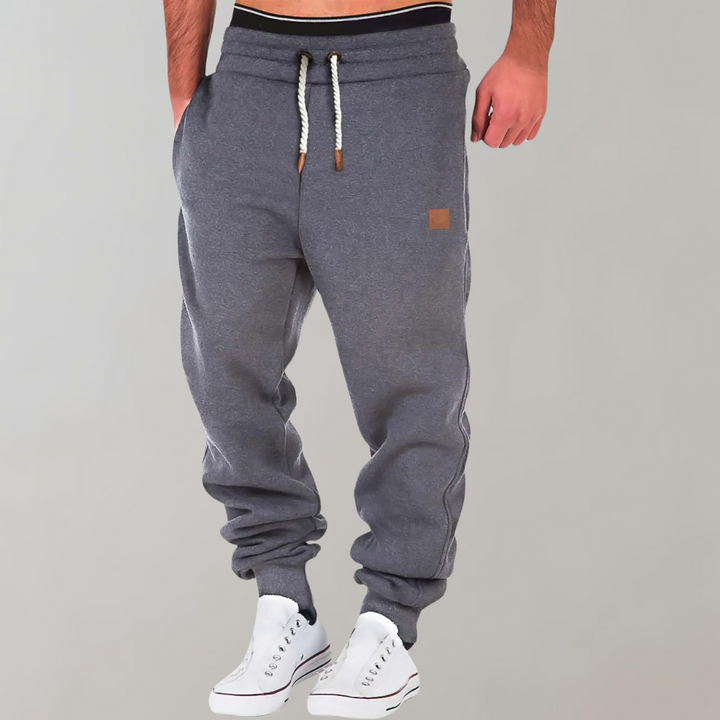 Man wearing comfortable men's baggy jogging pants with an everyday relaxed fit.