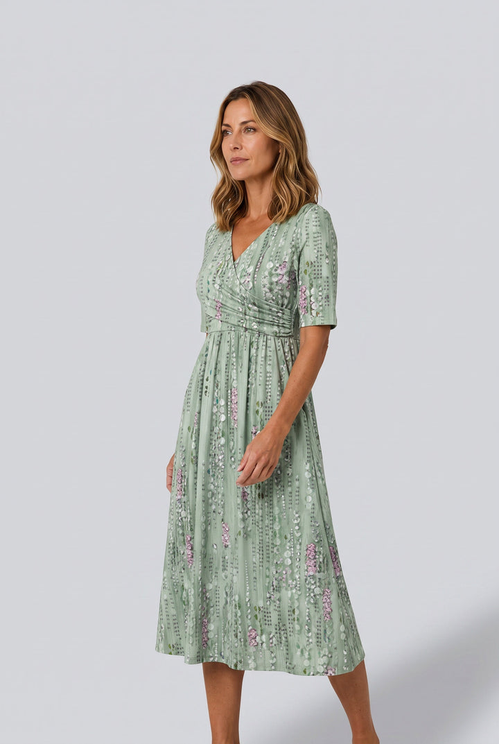 Stylish green A-line midi dress for women, with a faux wrap design and V-neck, ideal for summer or casual chic wear.