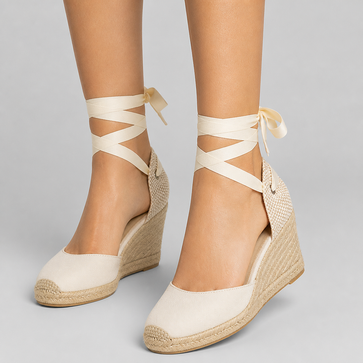 Classic women's espadrille wedge sandals with ankle-tie & closed toe, ideal for summer comfort.