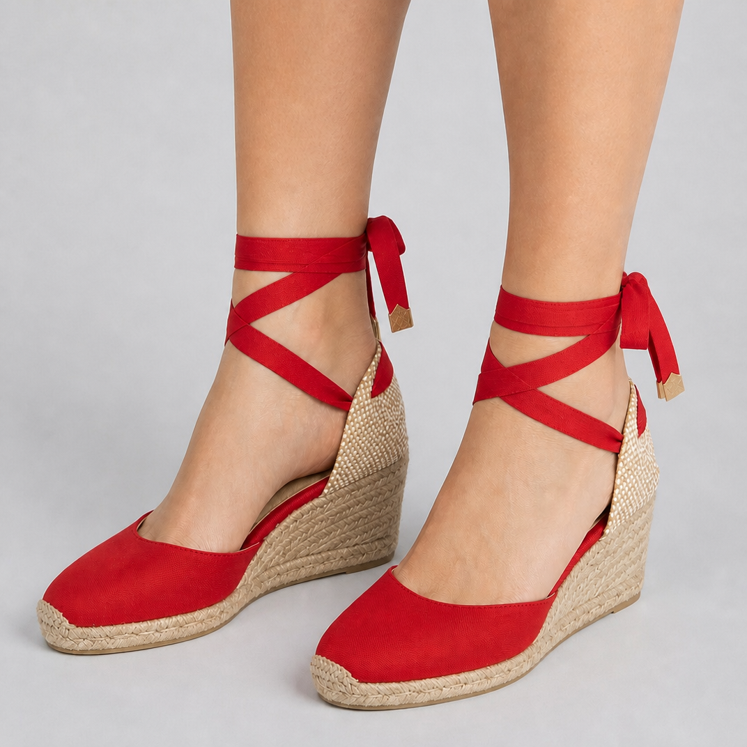 Elegant black espadrille wedge sandals with ankle-tie, comfortable women's summer vacation footwear.