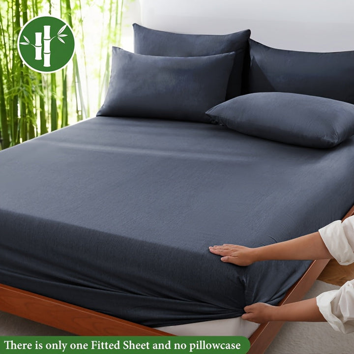 Cooling bamboo fiber fitted sheet, breathable & soft, perfect for comfortable bedding.