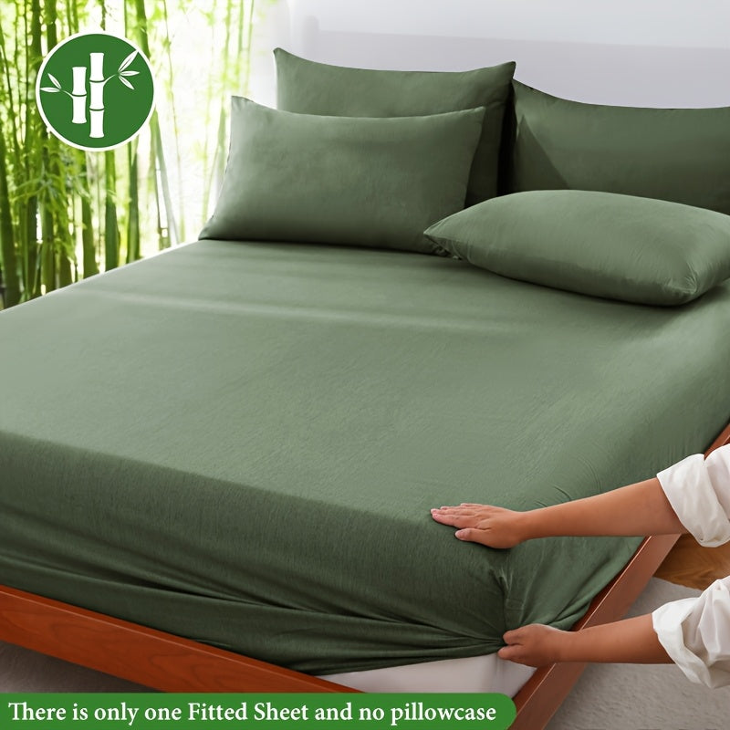 Ultra-soft bamboo fiber fitted sheet, breathable & gentle on skin for ultimate comfort.