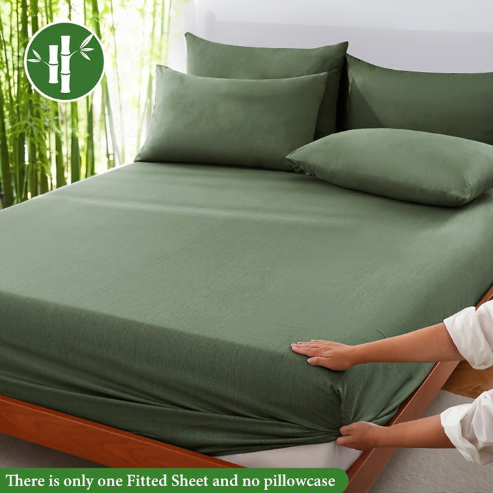 Ultra-soft bamboo fiber fitted sheet, breathable & gentle on skin for ultimate comfort.