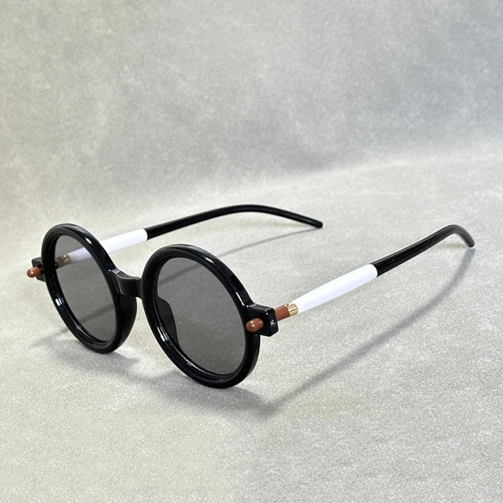 Unisex round retro tinted eyewear, a timeless accessory adding vintage flair.
