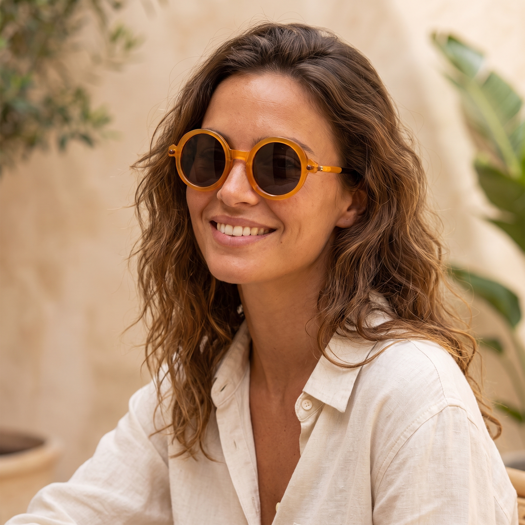 Round tinted retro sunglasses, an iconic unisex fashion statement for sunny days.