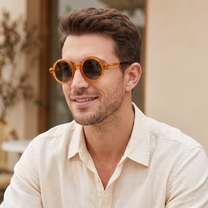 Vintage-inspired round sunglasses with stylish tinted lenses, a unisex fashion staple.