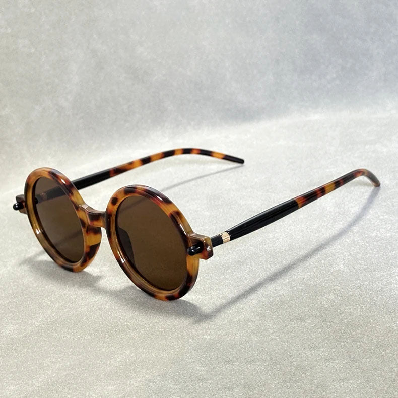 Round tinted retro sunglasses, a versatile vintage fashion accessory for him & her.