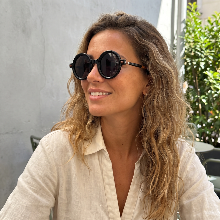 Iconic retro round eyewear, tinted lenses for a cool vintage look, unisex appeal.