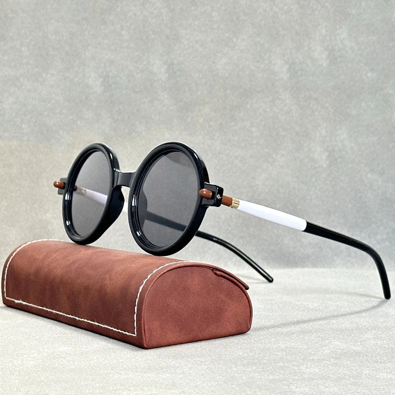 Fashionable unisex round retro sunglasses with unique tinted lenses for a standout style.