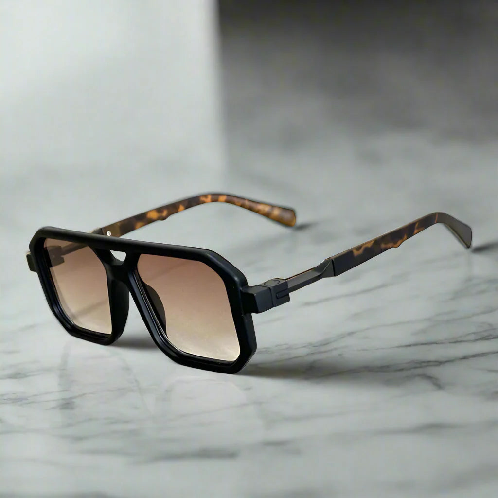 Sleek black frame unisex square aviator sunglasses with dark UV400 lenses. Modern fashion eye protection.