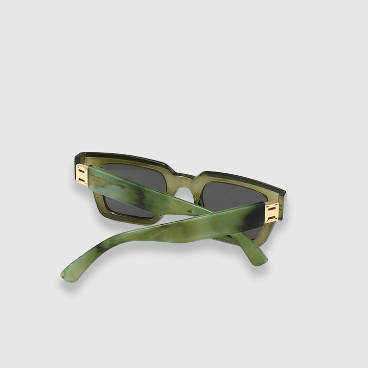 Fashionable chunky square sunglasses; unisex eyewear with striking marble arms design; trendsetter.
