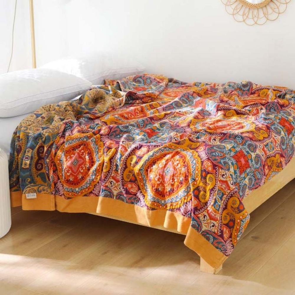 Lightweight moisture-wicking cooling blanket in a boho reversible design. Unisex comfort for restful summer sleep.
