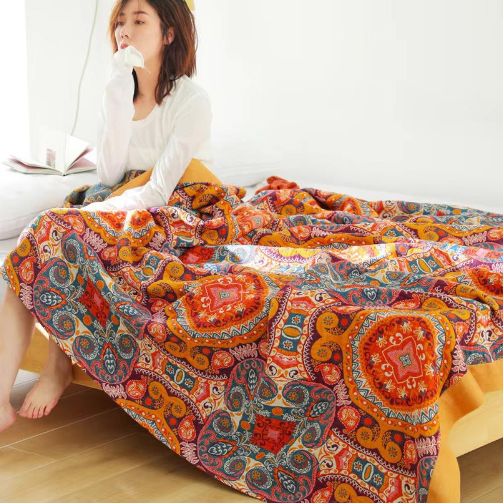 Stylish boho reversible blanket in cooling cotton, perfect for summer bedding. Lightweight and unisex home comfort.