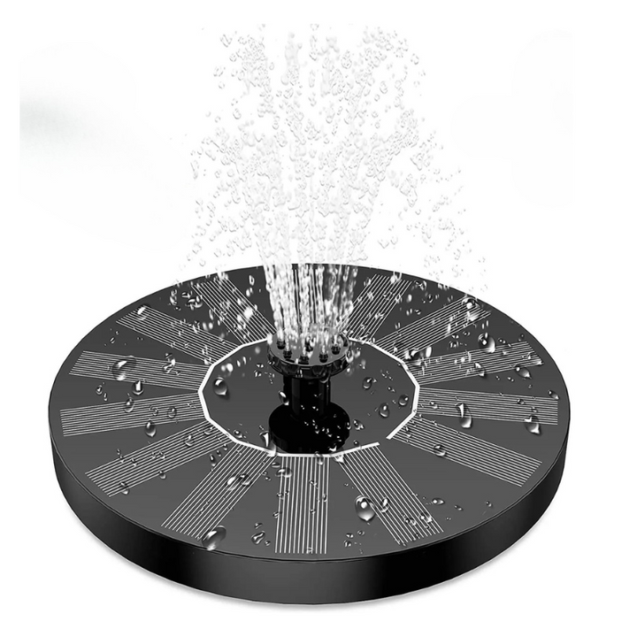 Eco-friendly solar powered floating fountain spraying water in a bird bath, perfect garden decor without electricity.